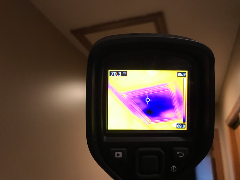 Thermal image of missing insulation at attic hatch by Dairyland Home Inspection