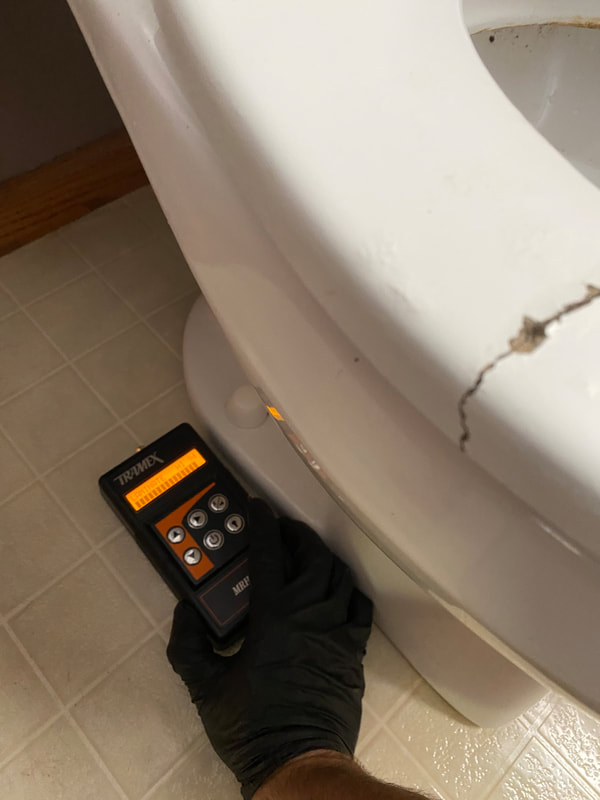 Toilet leak found during a home inspection by Dairyland Home Inspection in Racine, Wisconsin.
